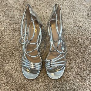 Silver strappy heels. Worn one day for a wedding.